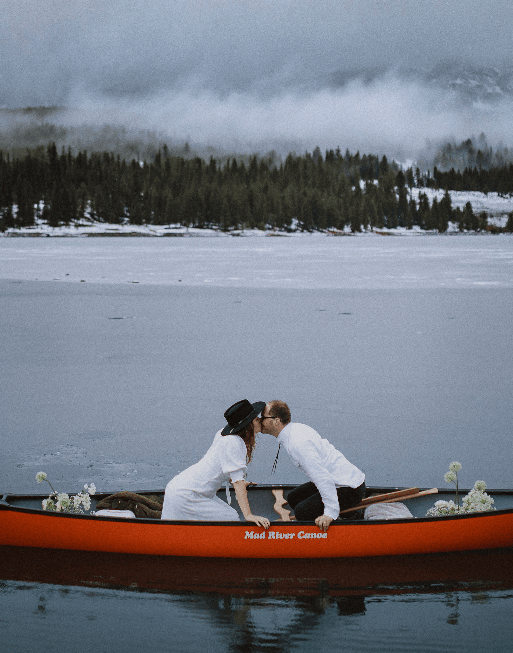 couple in kayak for Montana elopement