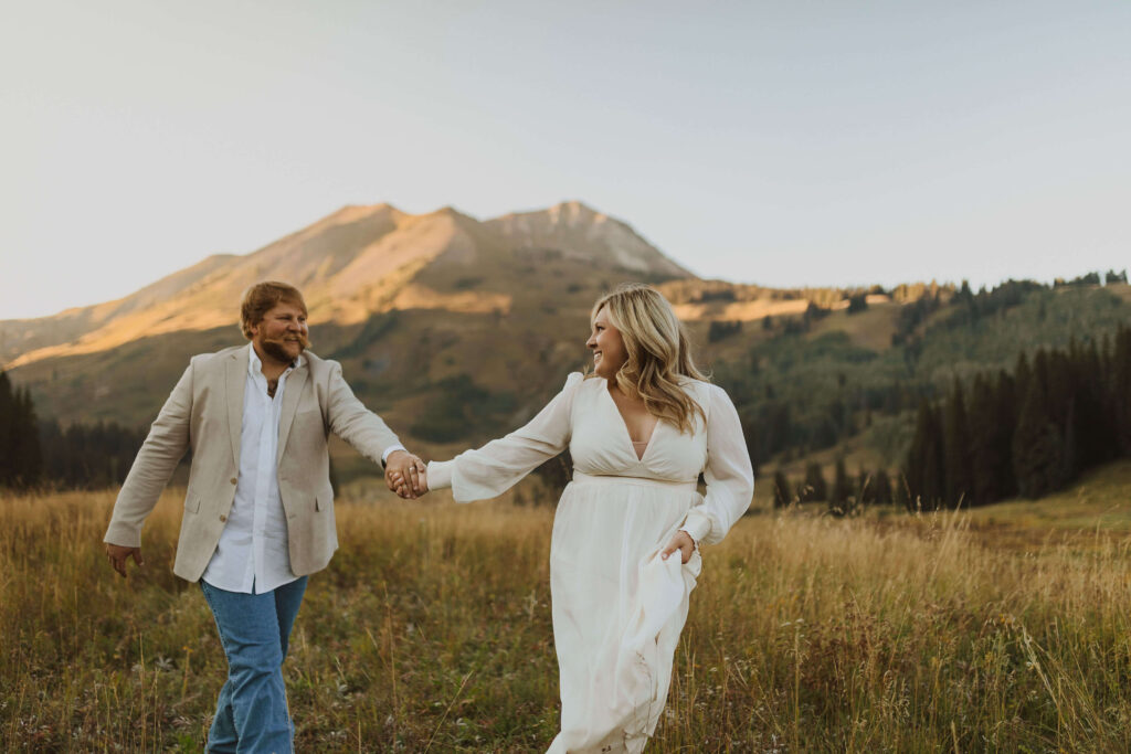 Elopement couple holding hands and smiling