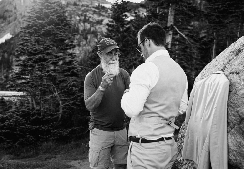 groom getting ready with dad for Lake Isabelle elopement 