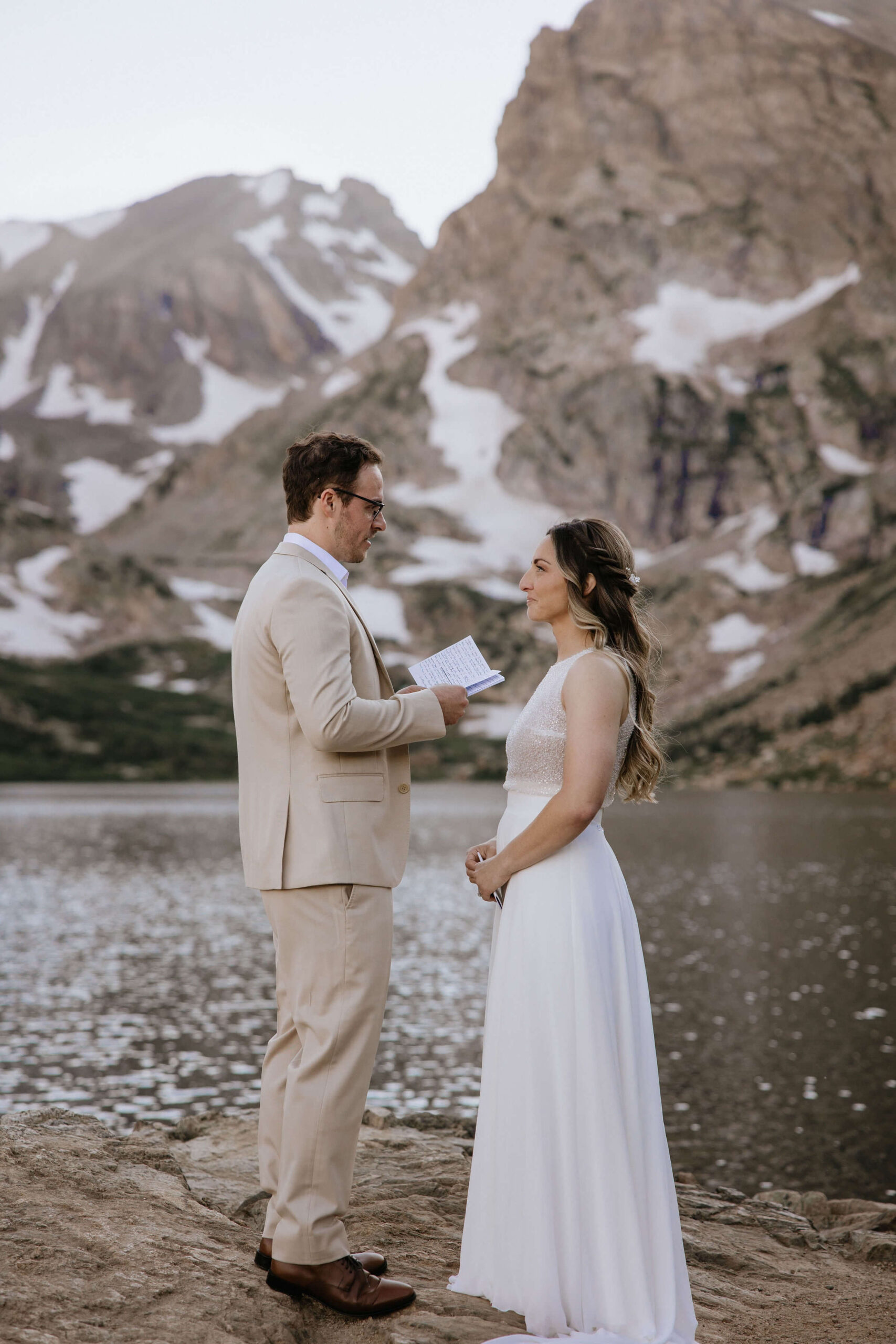 couple reading vows for Colorado elopement at Lake Isabelle