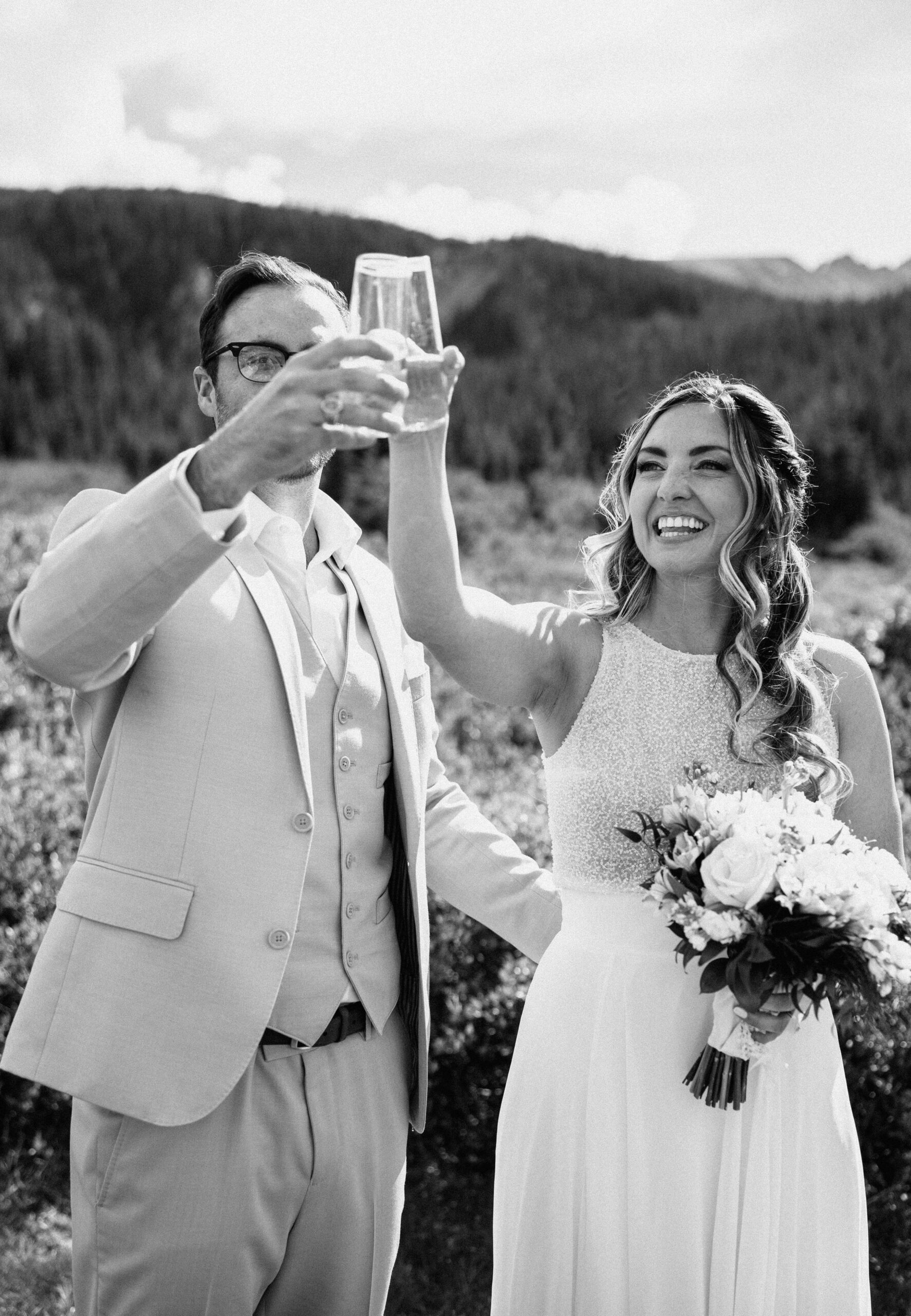 bride and groom doing a cheers