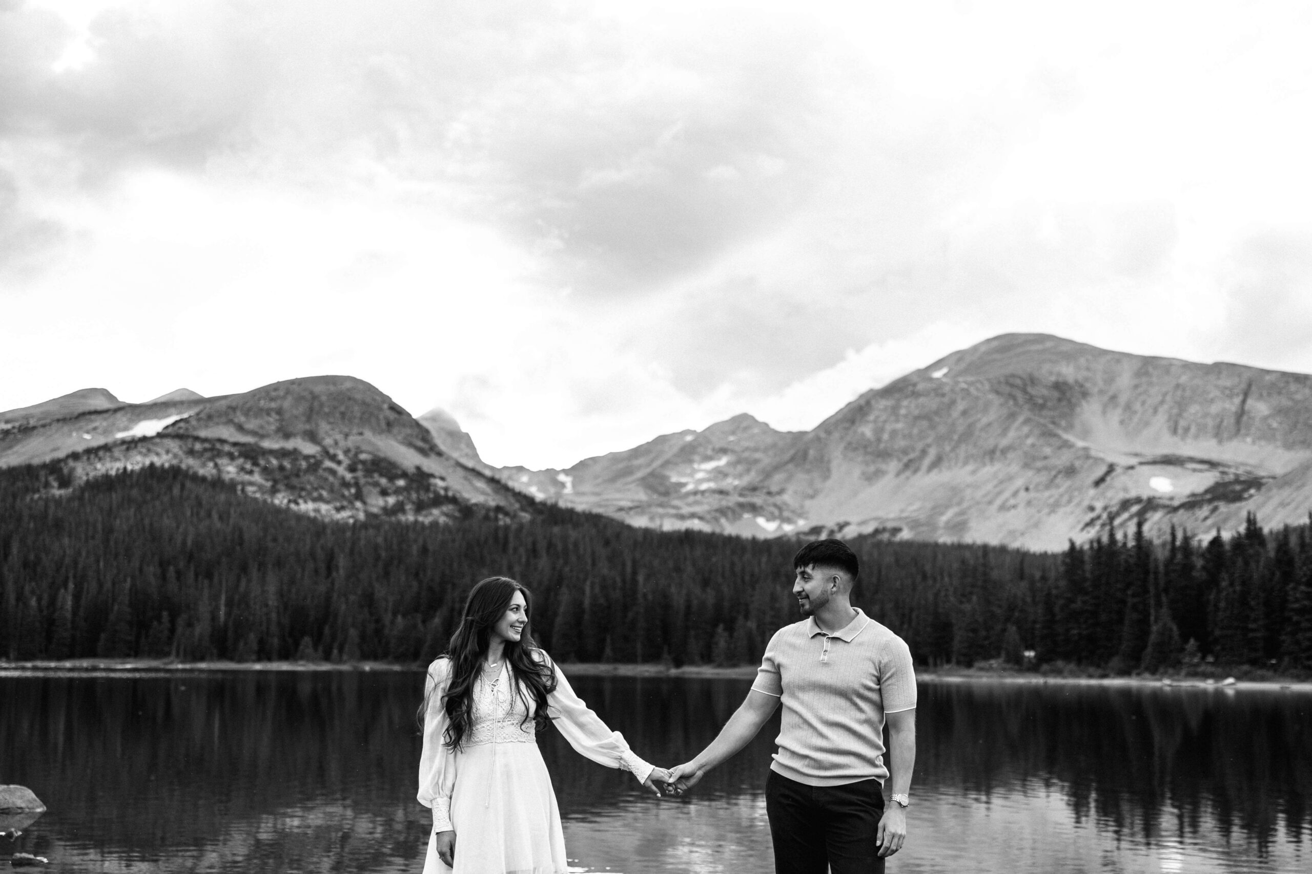 couple holding hands next to Brainard Lake