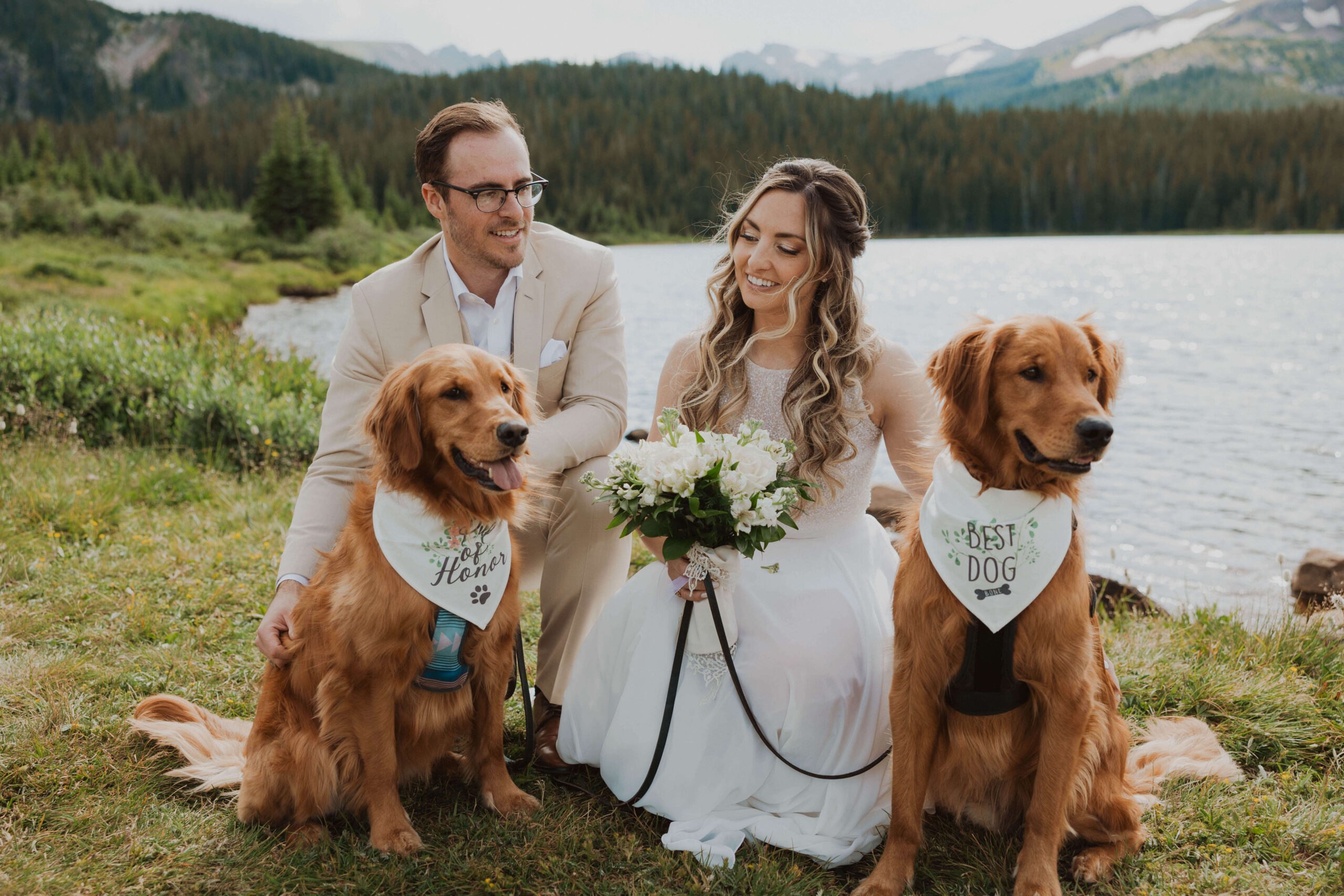 Brainard Lake elopement couple posing with two dogs