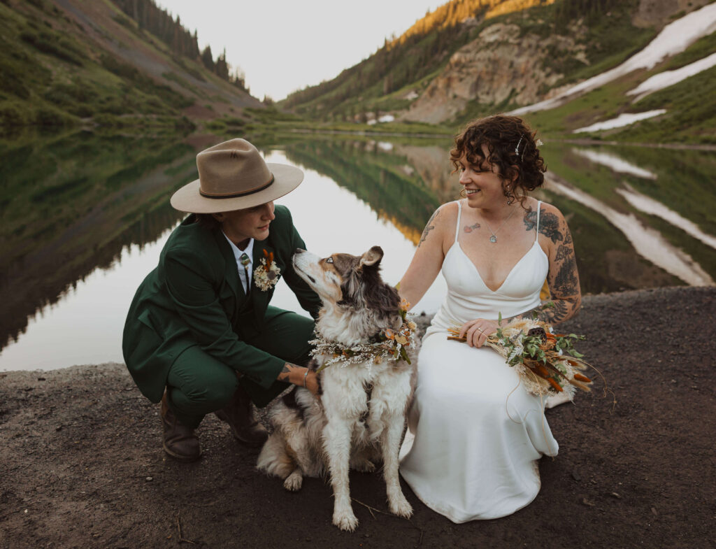 couple posing with dog for Crested Butte elopement pictures