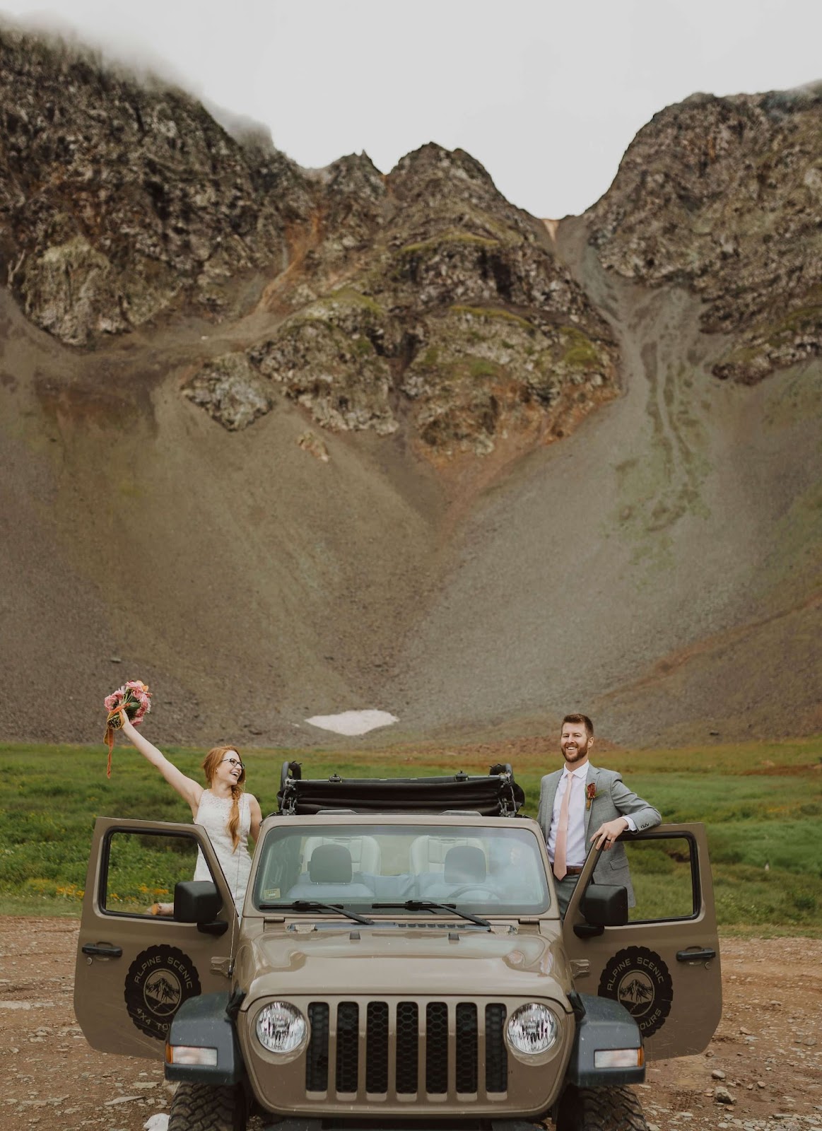 Ouray elopement couple posing for picture with Jeep
