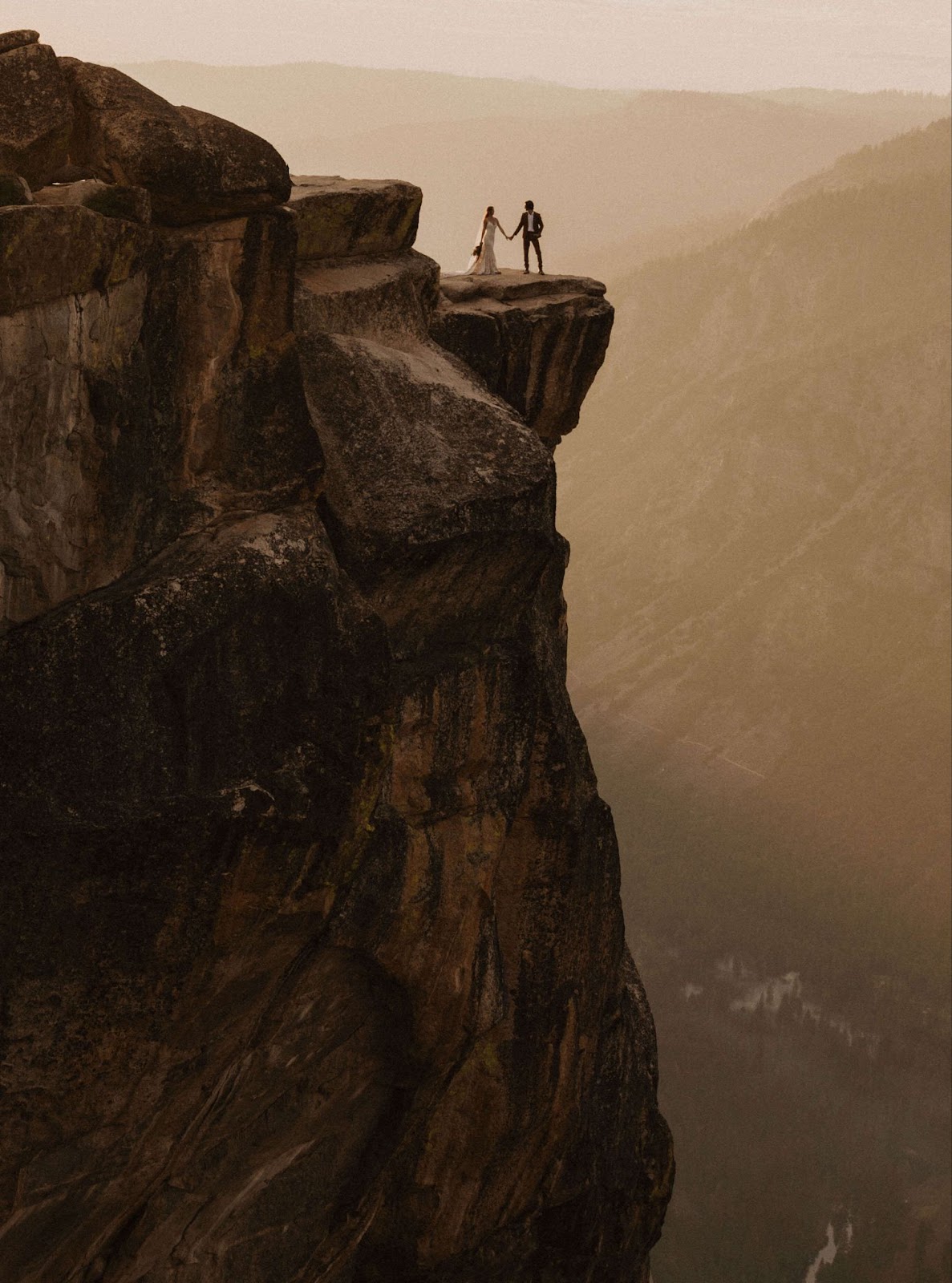 couple posing on Taft Point for Yosemite elopement