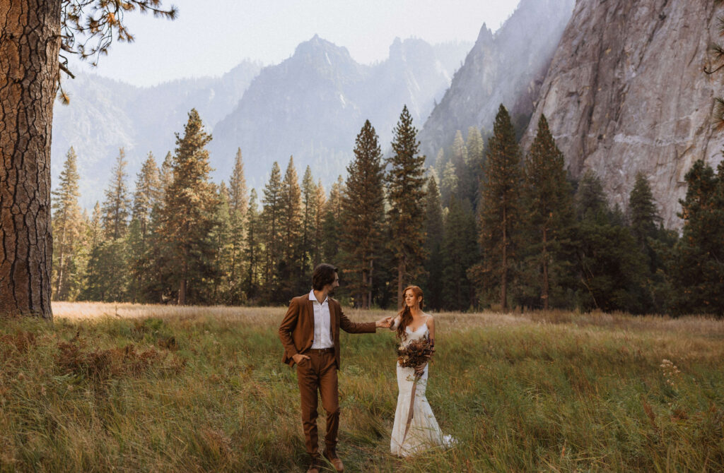 elopement couple walking together for elopement photos in Yosemite