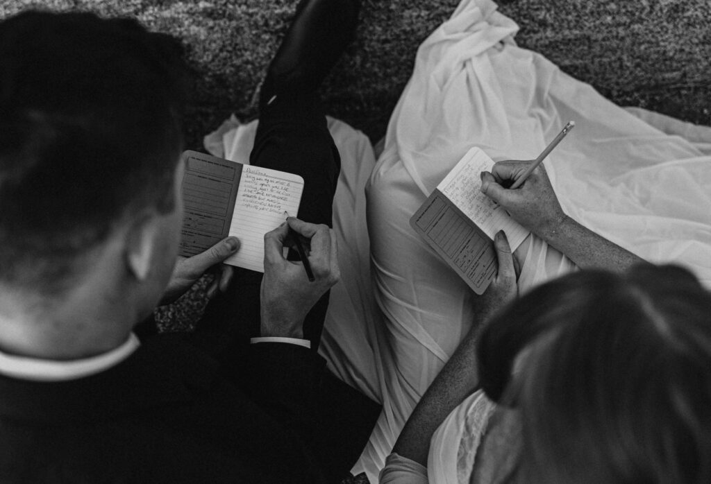 couple writing vows posing for Yosemite elopement photos