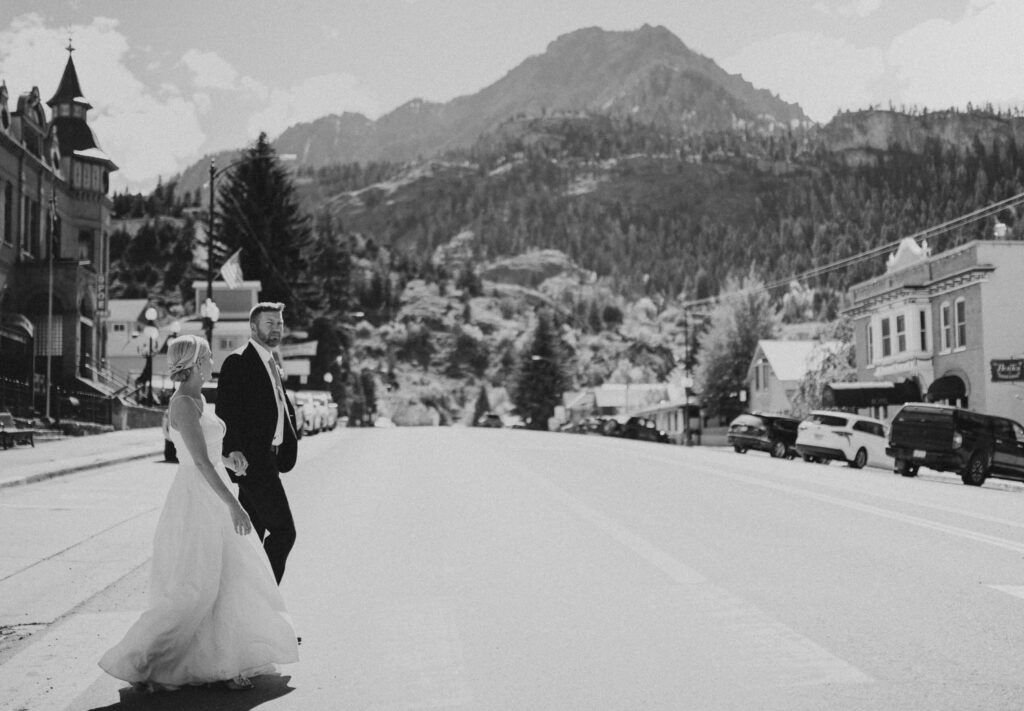 elopement couple walking in the street in Ouray
