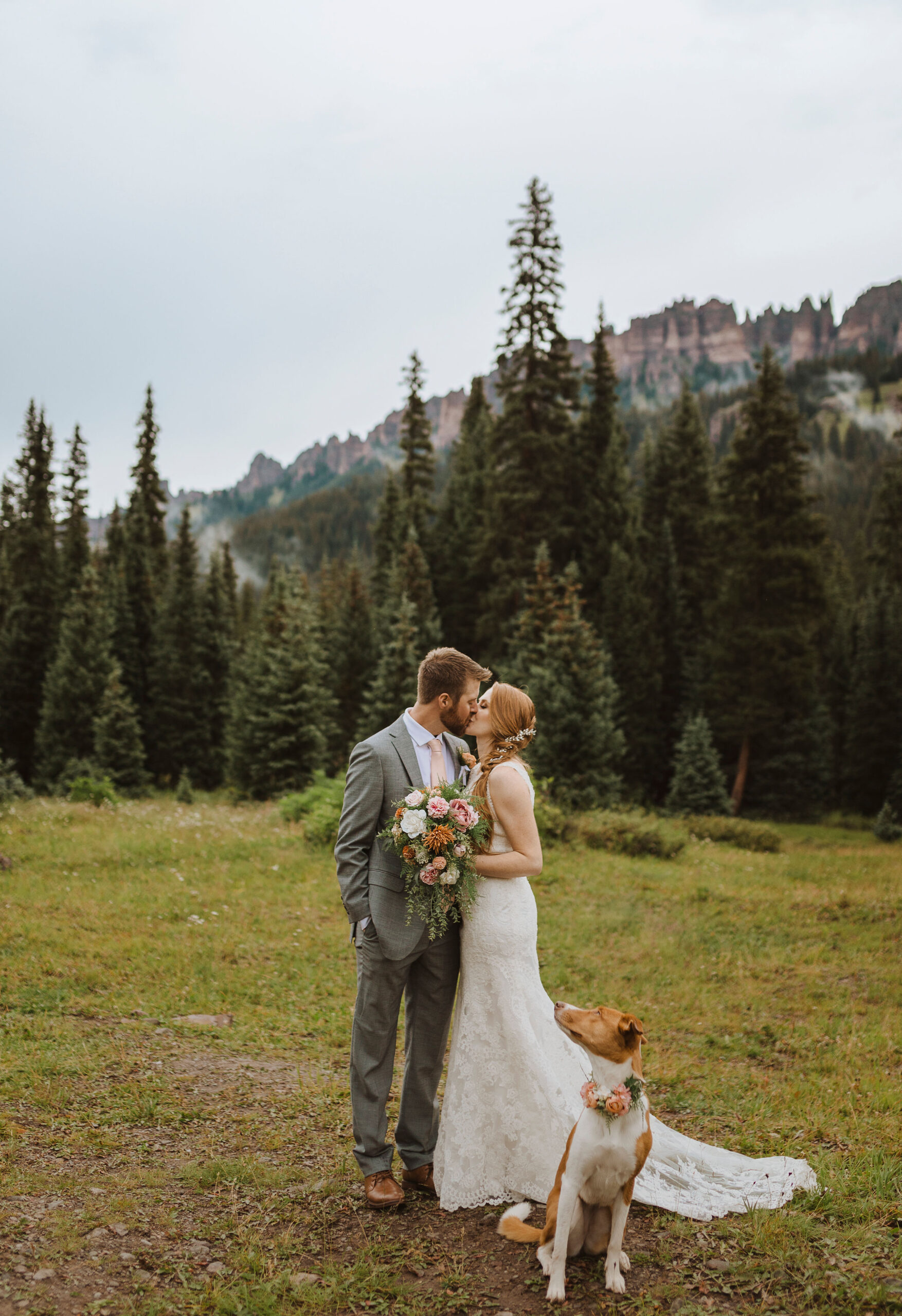 elopement couple kissing with dog beside them for dog-friendly elopement