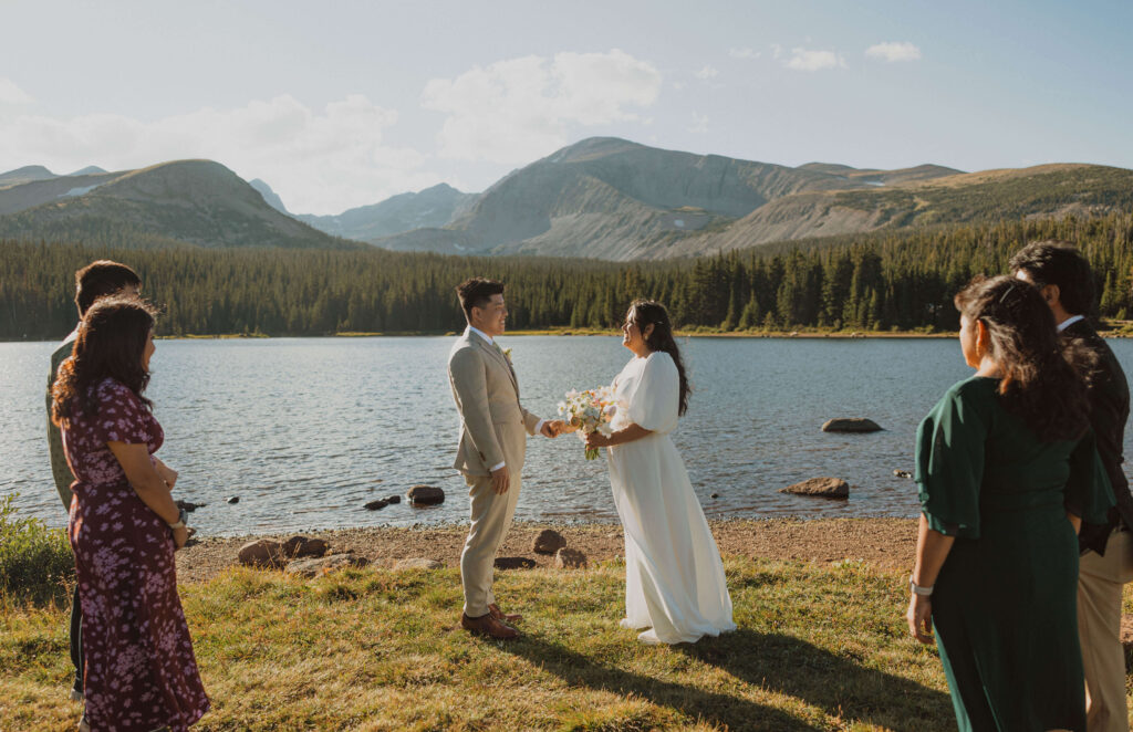 bride and groom getting married at Brainard Lake with guests