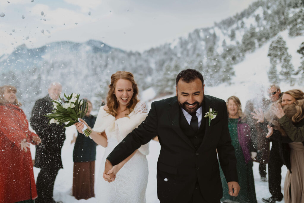 couple leaving elopement ceremony at Halfway House in Boulder