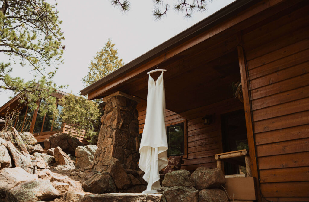wedding dress hanging on cabin