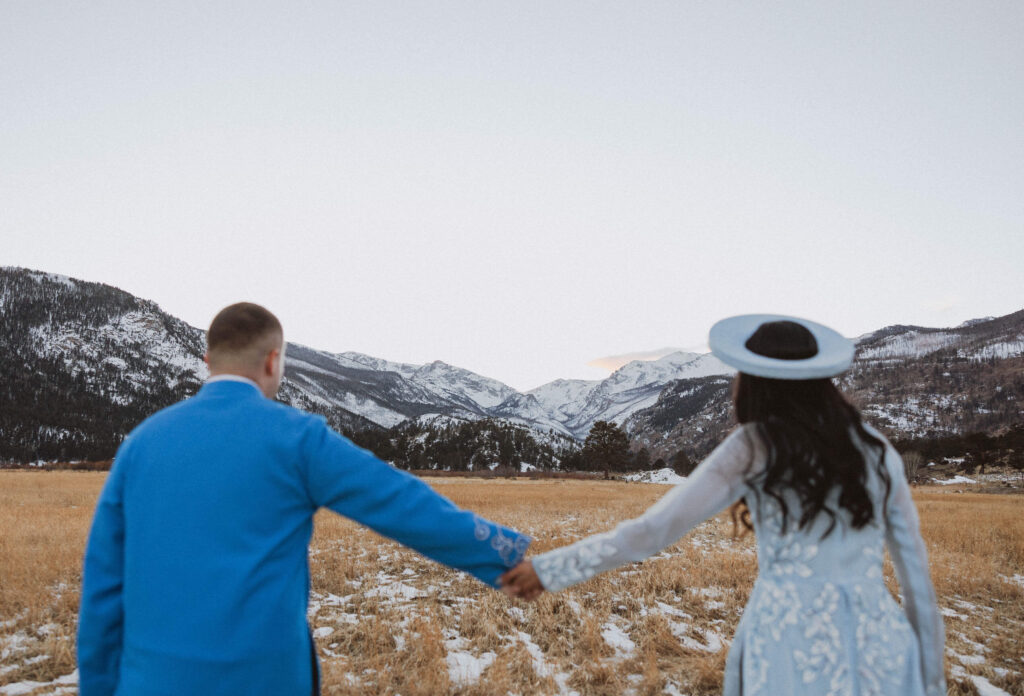 bride and groom holding hands in Rocky Mountain National Park