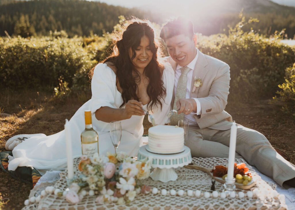 bride and groom cutting cake at Brainard Lake elopement