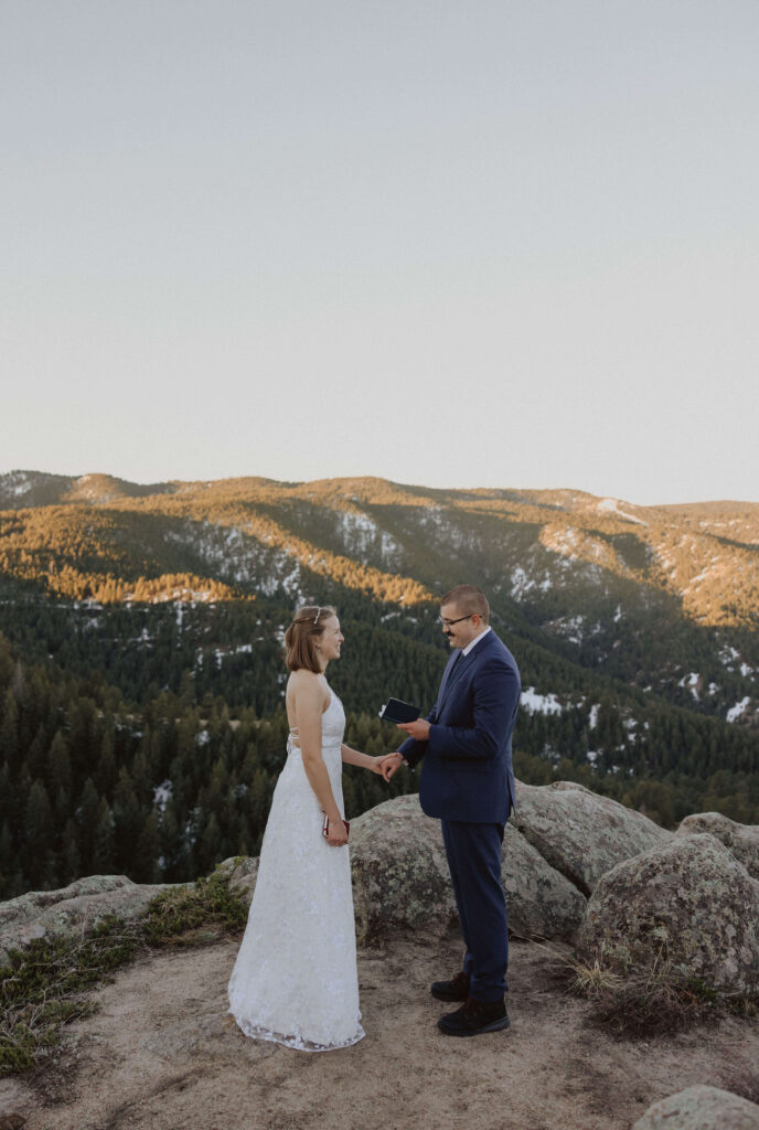 couple exchanging vows for Boulder elopement ceremony