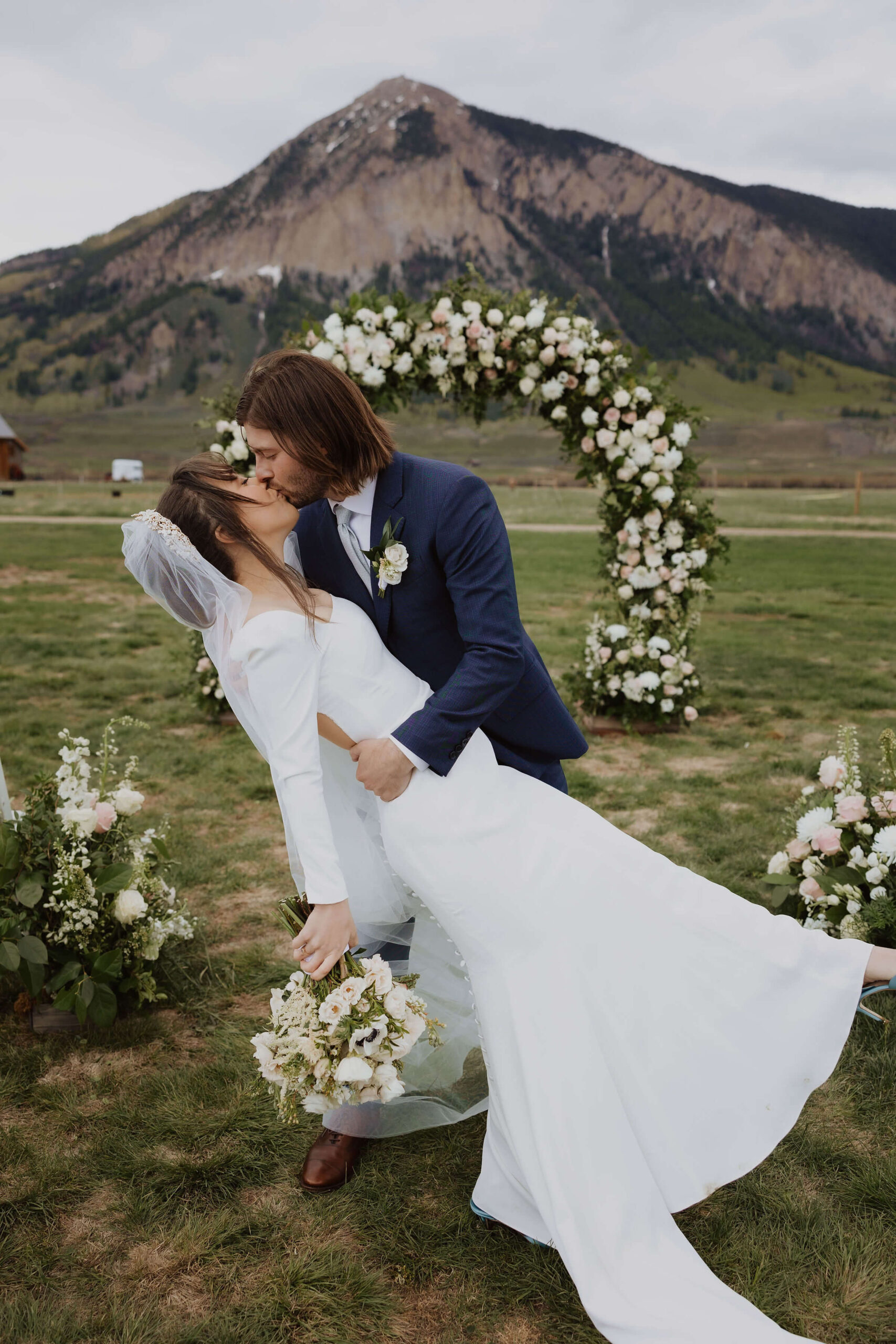 Couple getting married in Colorado and posing for picture at ceremony site