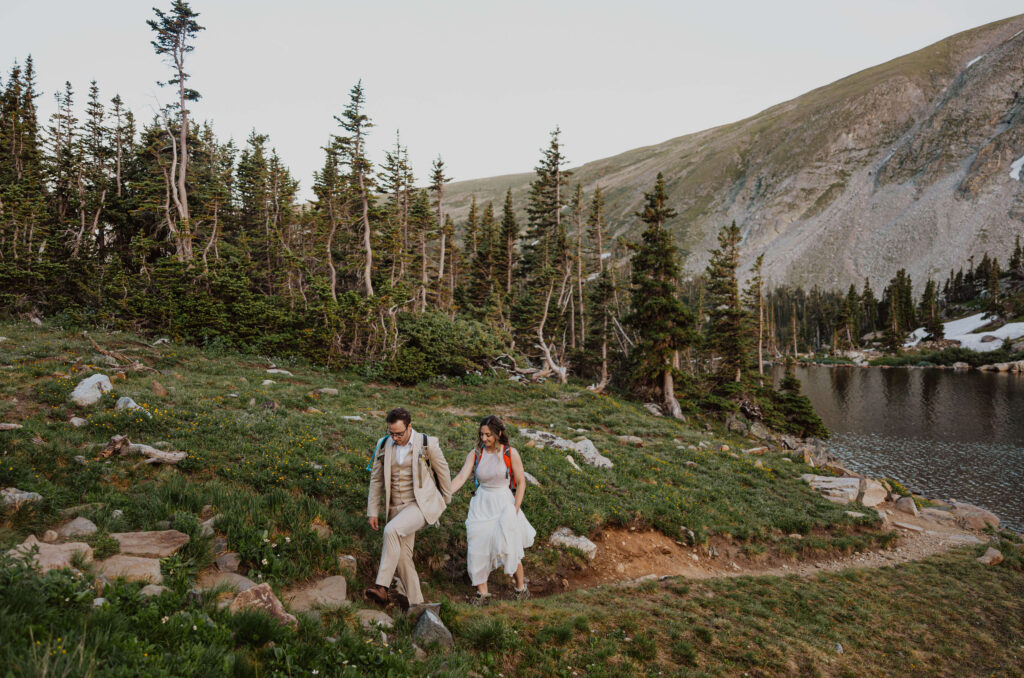 couple hiking in Lake Isabelle for elopement