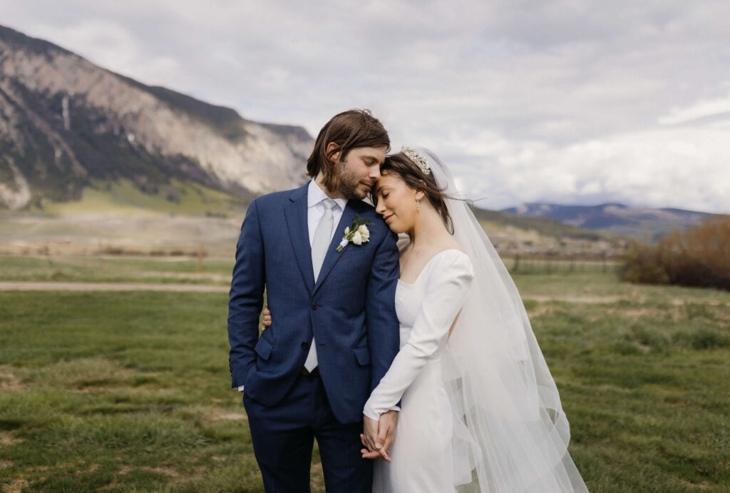 Couple posing for Colorado mountain wedding pictures