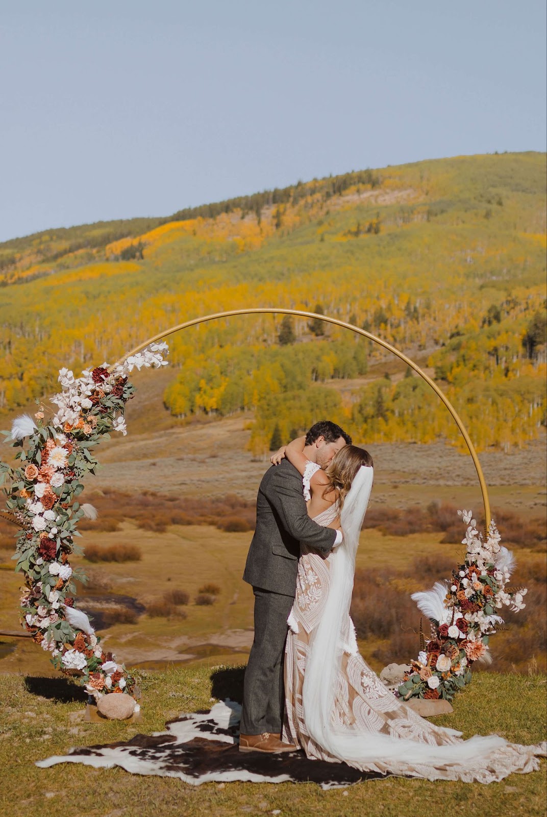 bride and groom kissing at Cement Creek Ranch for Colorado mountain wedding