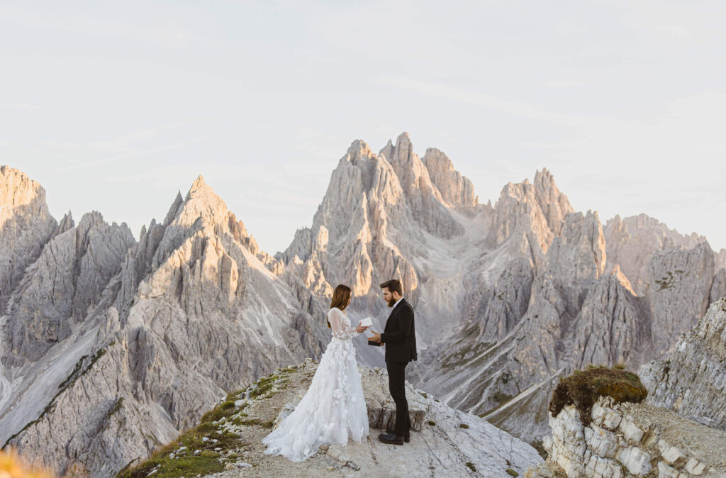 Bride and groom exchanging vows in the Dolomites for adventure elopement