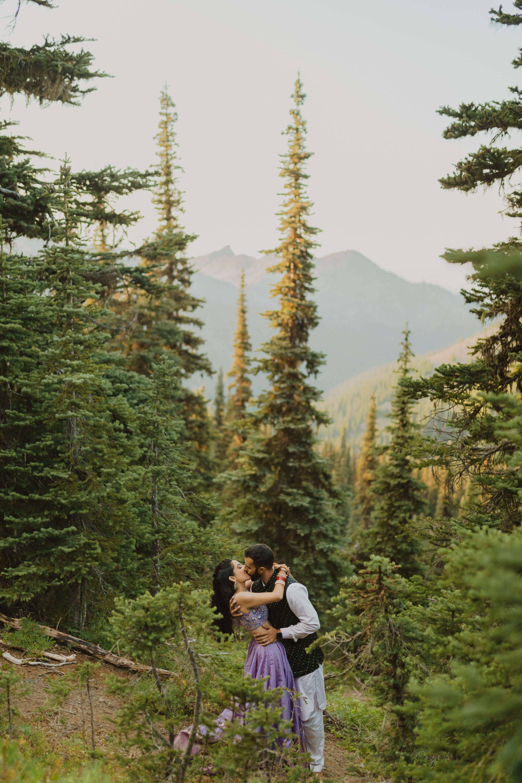 Couple posing outdoors for adventure elopement photos