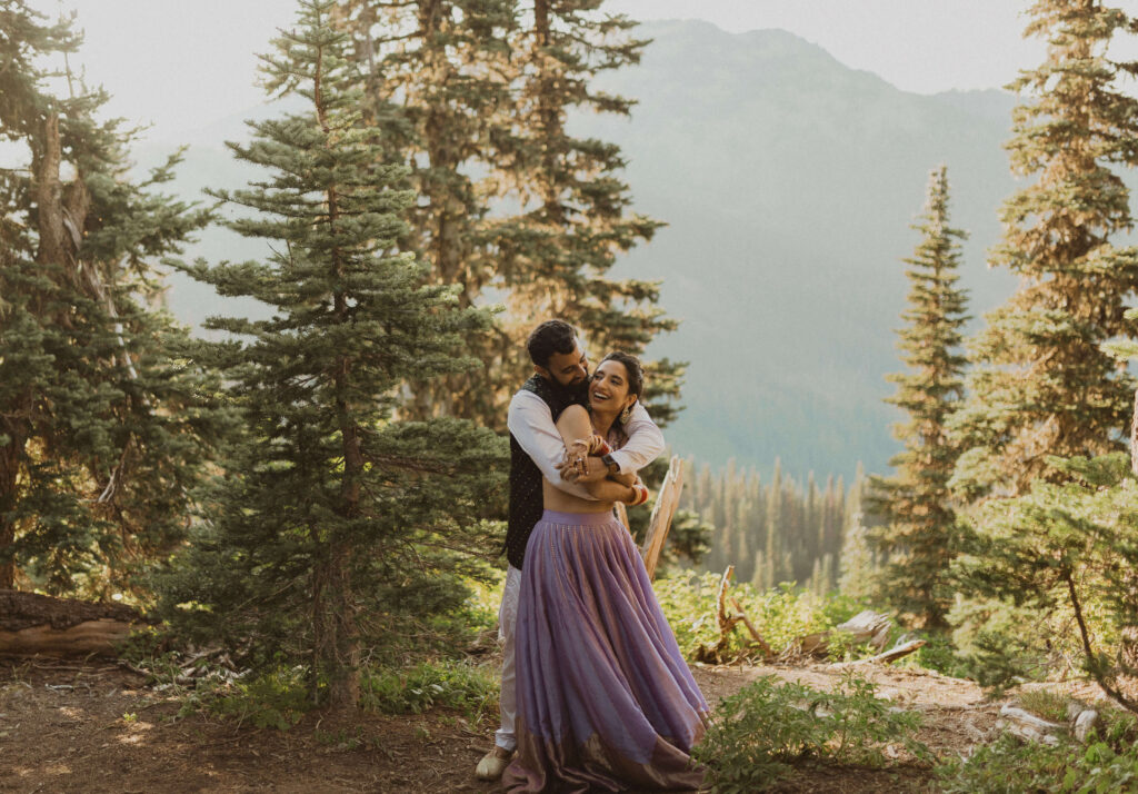 bride and groom hugging and smiling