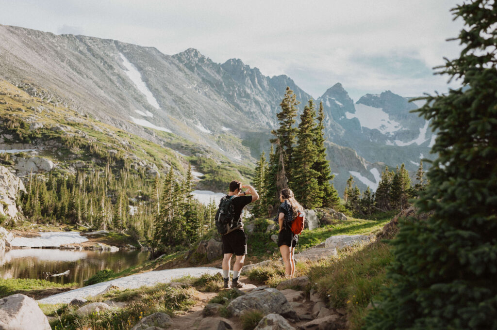 couple hiking at Lake Isabelle