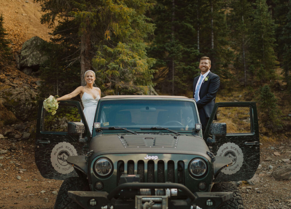 bride and groom posing in jeep for elopement pictures