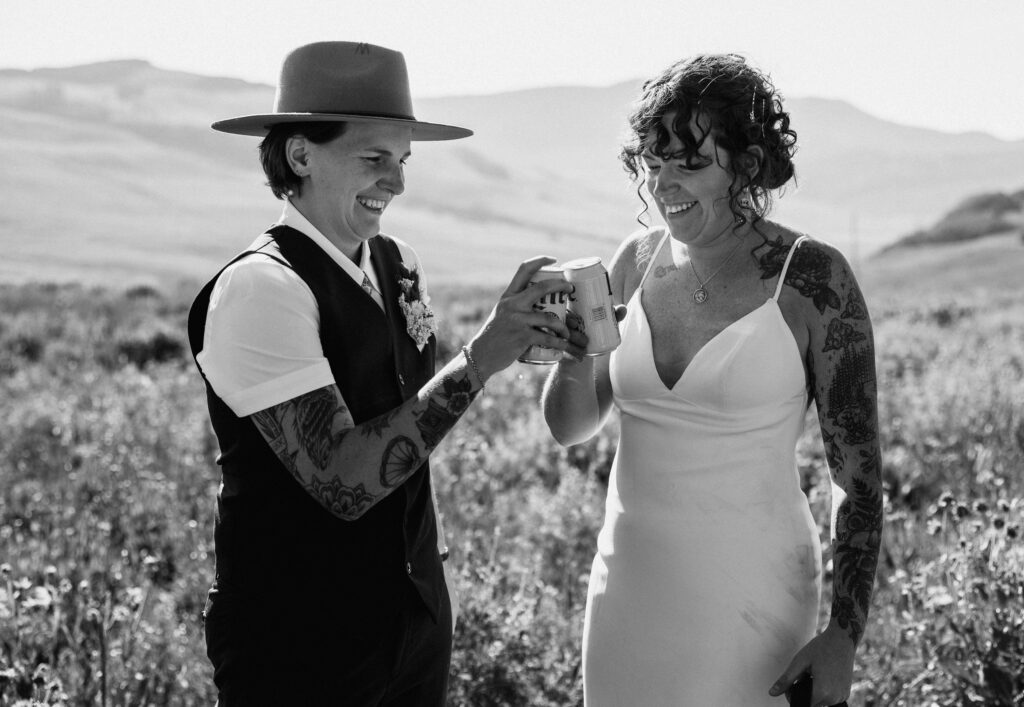 elopement couple drinking beer and smiling