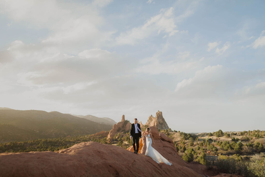 bride and groom walking at Garden of the Gods