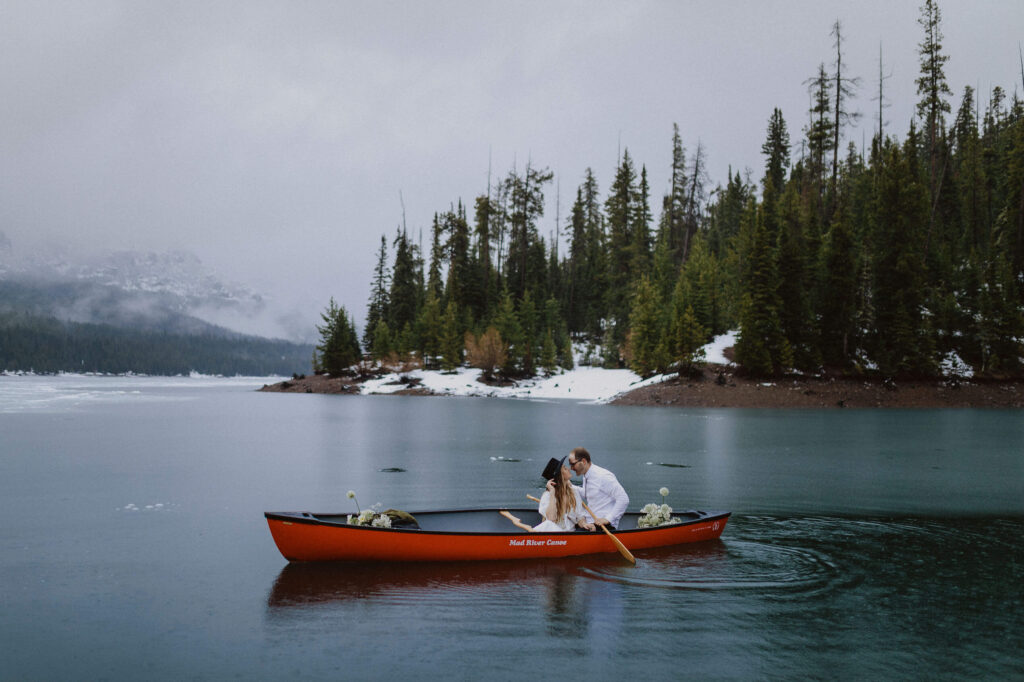 bride and groom kayaking