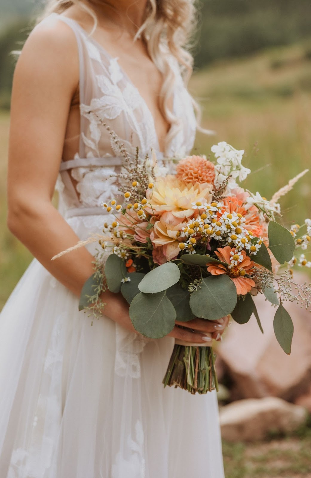 Bride holding flowers for Maroon Bells wedding