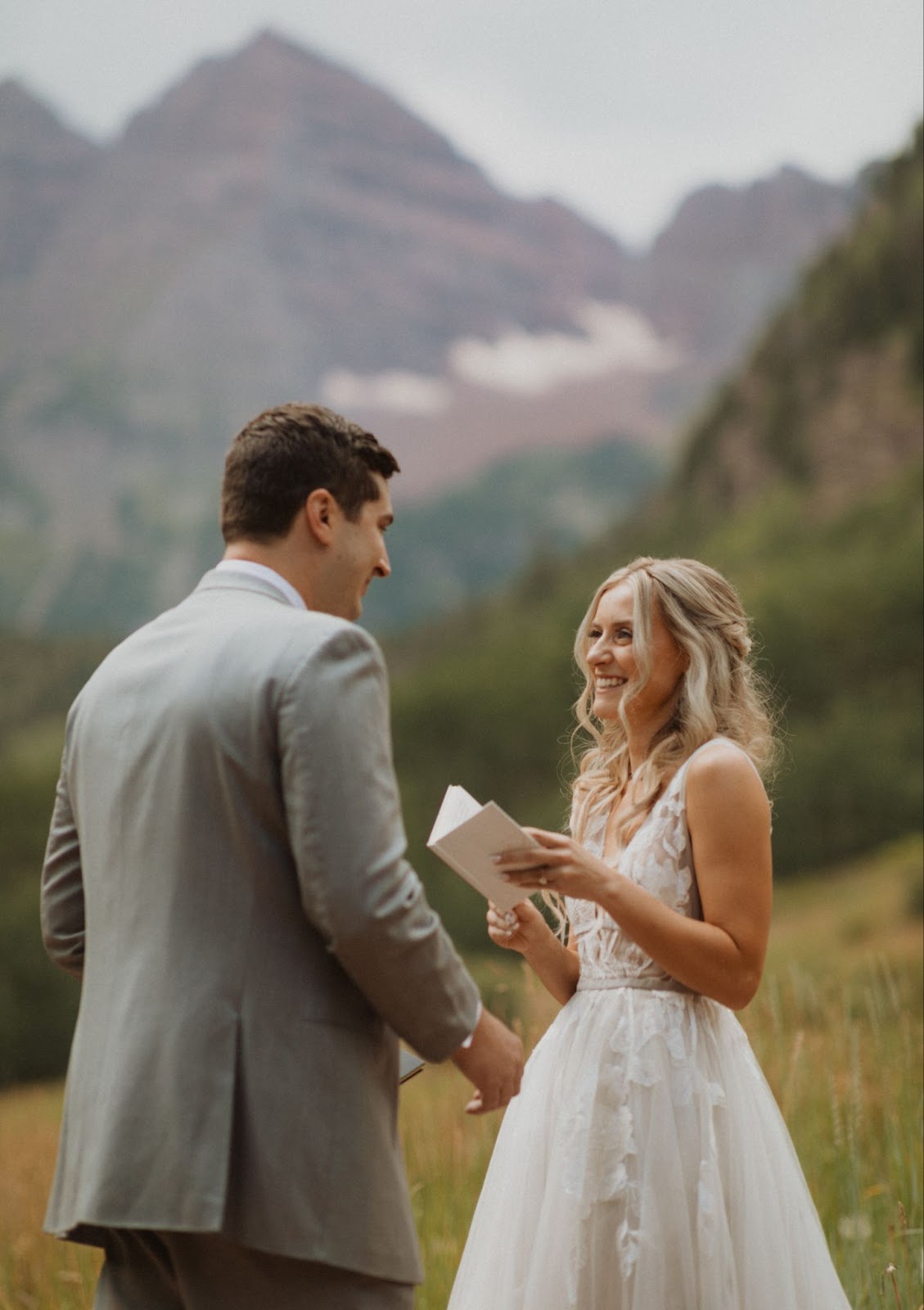 Bride reading her vows to husband at Maroon Bells 