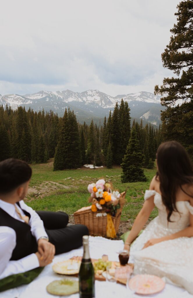 Bride and groom having picnic for elopement in Crested Butte