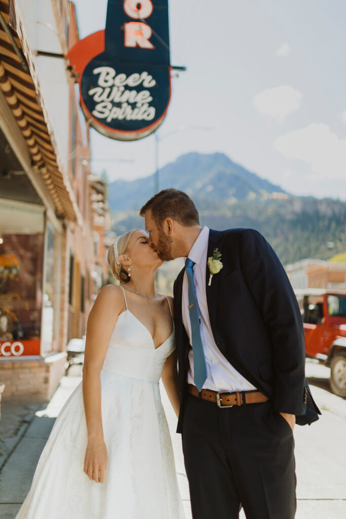 bride and groom kissing in downtown Ouray, Colorado