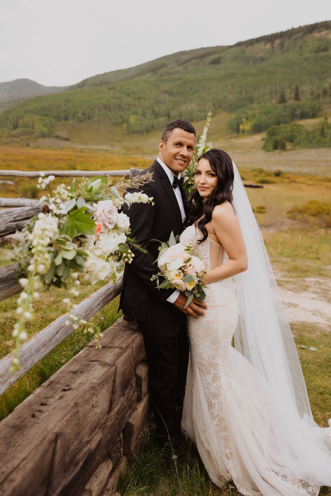 Bride and groom posing for Cement Creek Ranch wedding photos