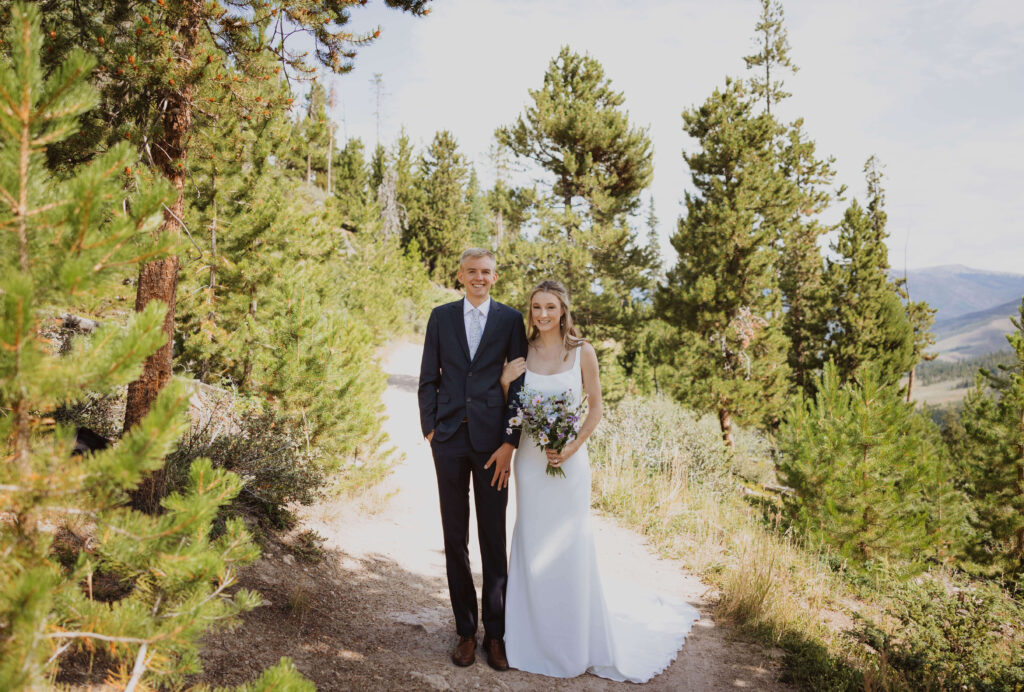 bride and groom posing surrounded by greenery at Sapphire Point Overlook for wedding photos