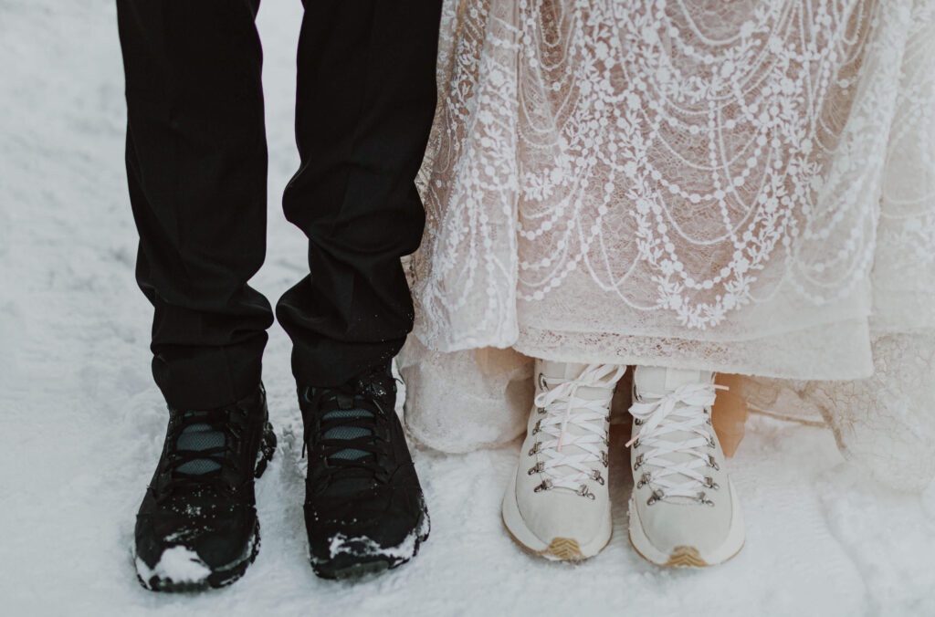 bride and groom's shoes standing in the snow 