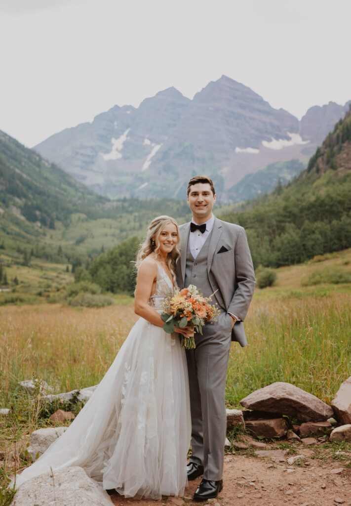 elopement couple posing at Maroon Bells in Colorado