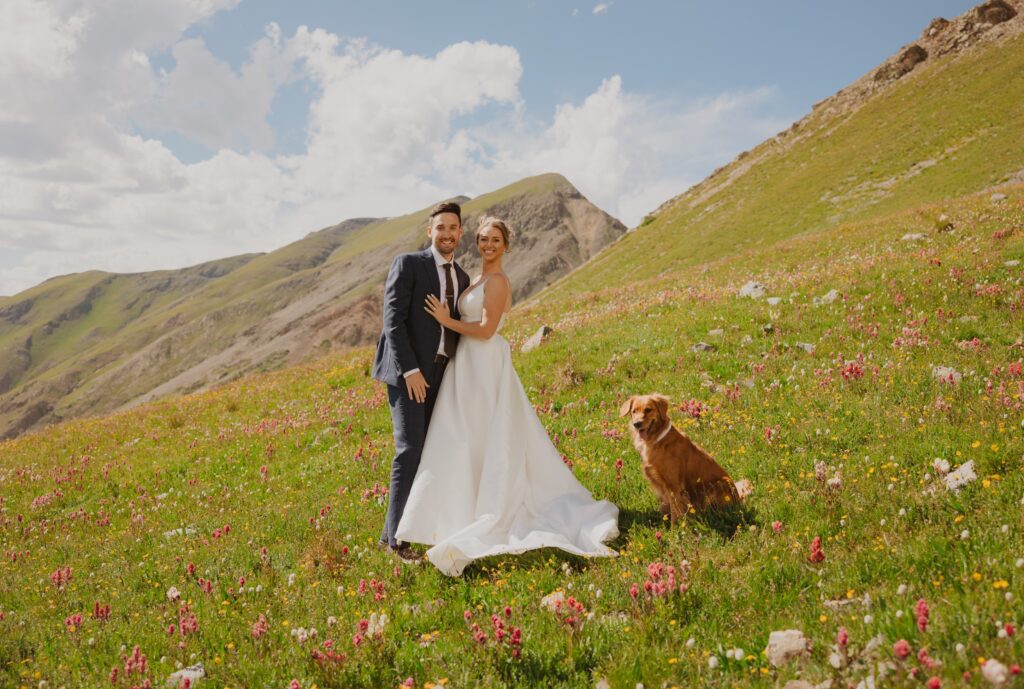 Bride, groom, and dog posing for San Juan Mountain elopement photos