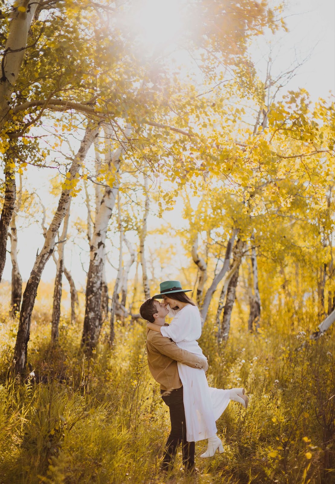 Couple posing for Rocky Mountain National Park engagement