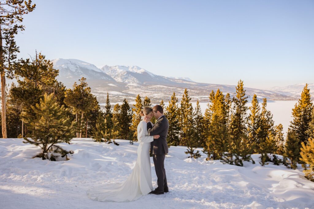 Couple in the snow at Sapphire Point Overlook for elopement