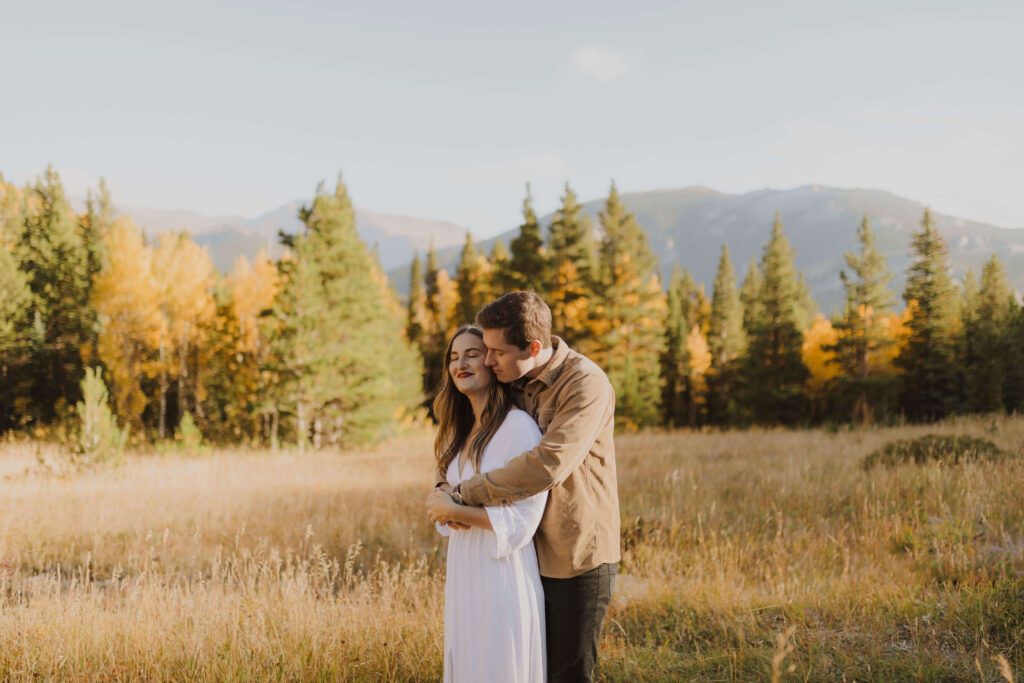 Couple posing for Rocky Mountain National Park engagement photos