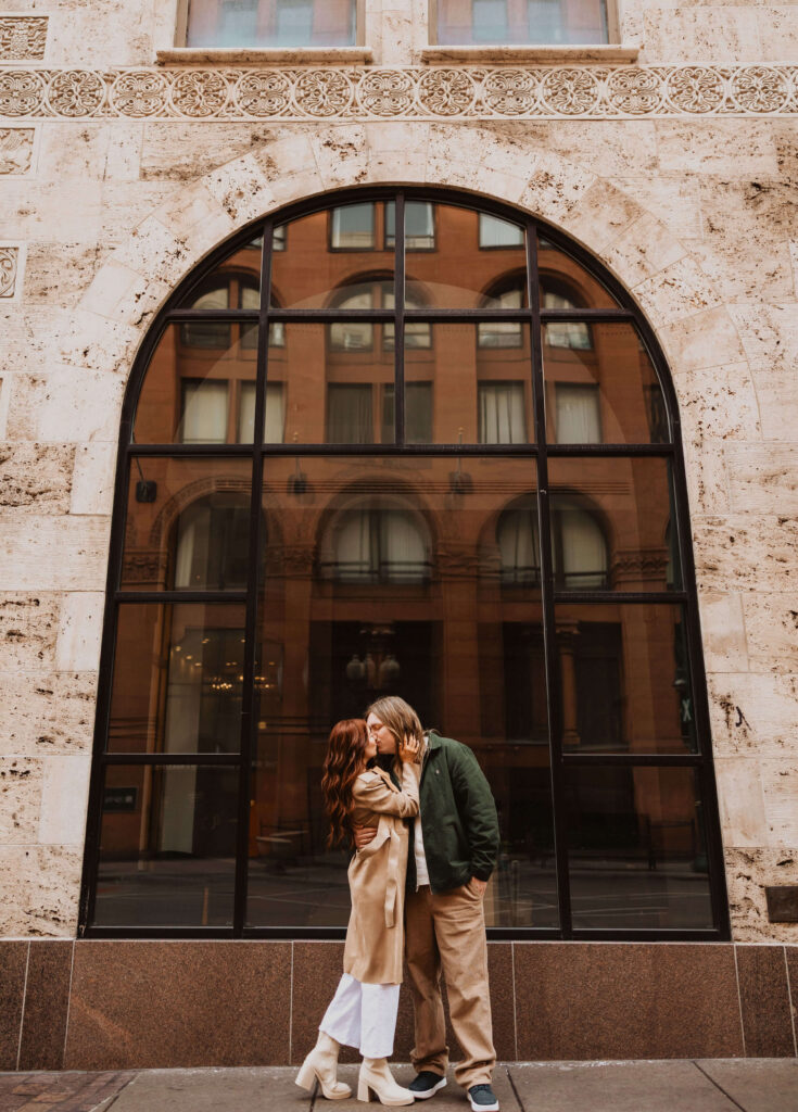 Couple posing for proposal photos in Downtown Denver