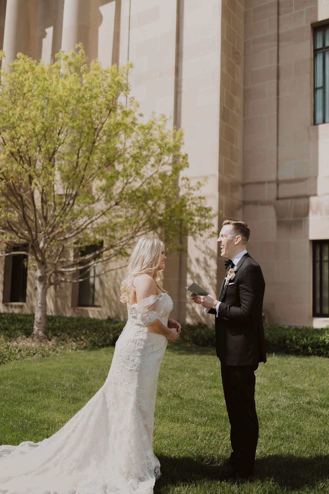 Bride and groom reading wedding vows in front of courthouse in Colorado