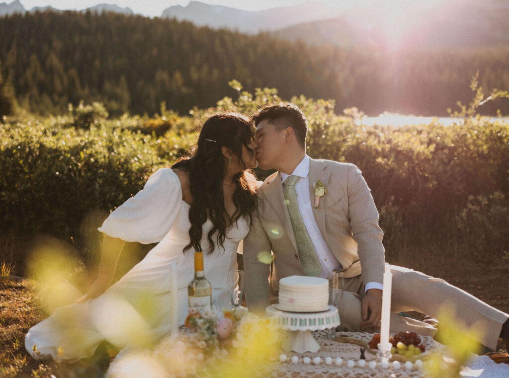 Bride and groom with cake at Brainard Lake