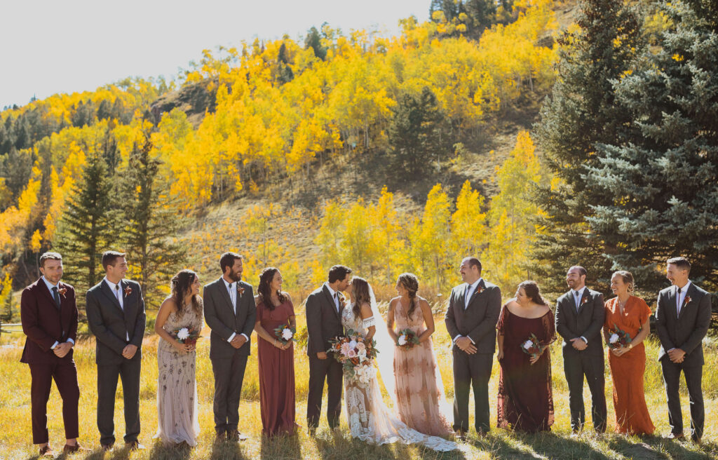 Wedding party backed by trees