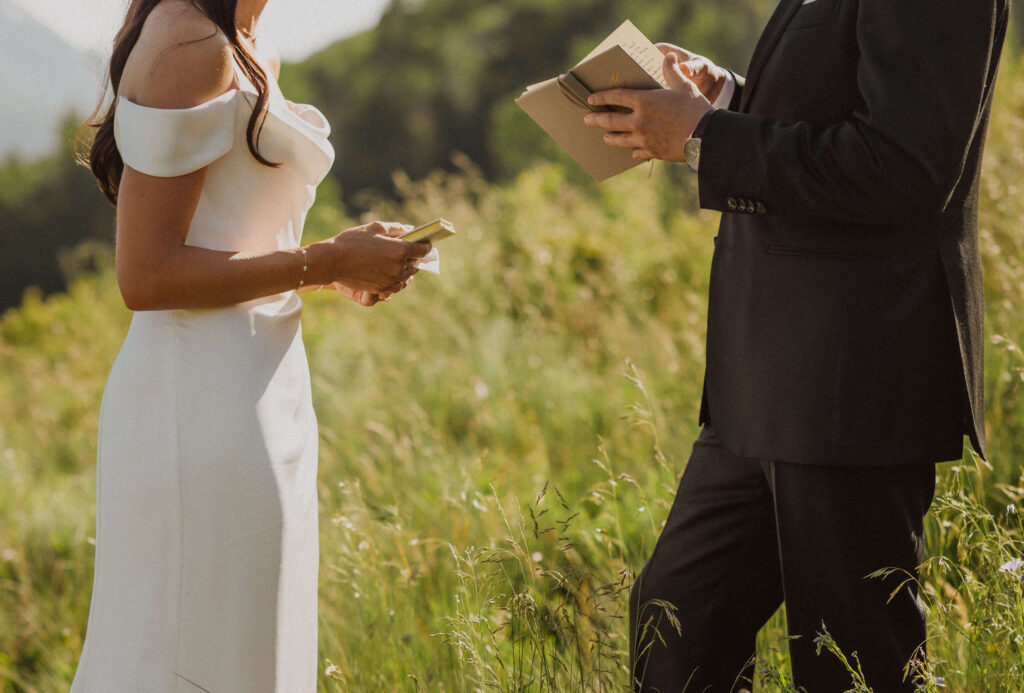 Bride and groom reading vows