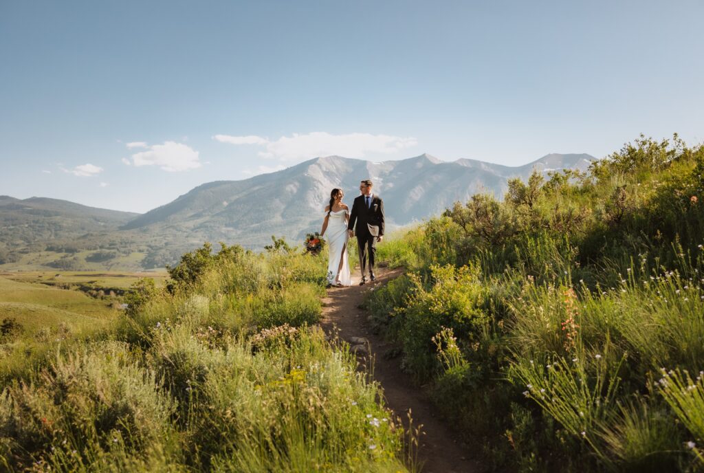 Bride and groom walking outside in Crested Butte for wedding